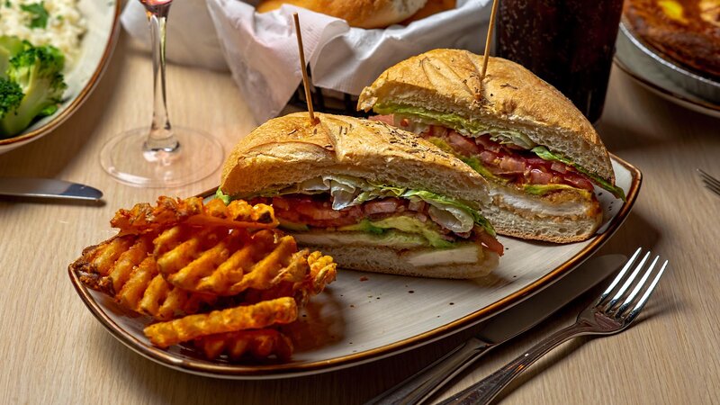 Chicken sandwich with side of waffle fries