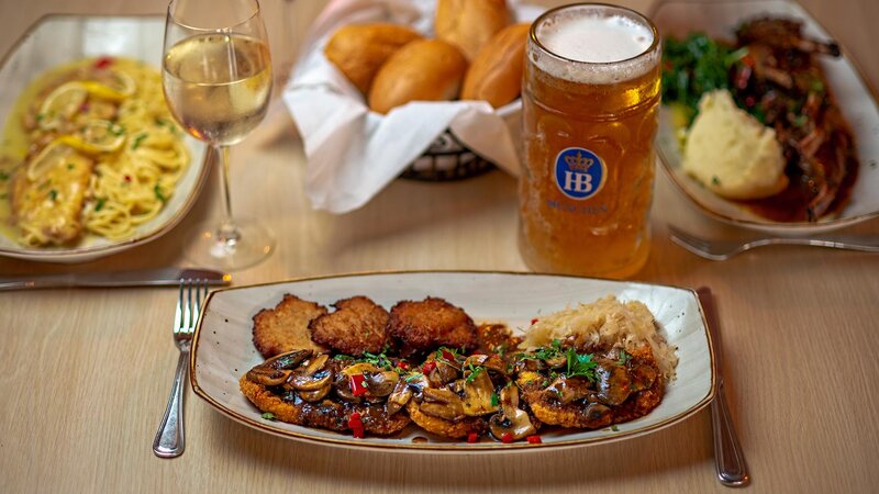 Schnitzel with side of potato pancakes and sauerkraut