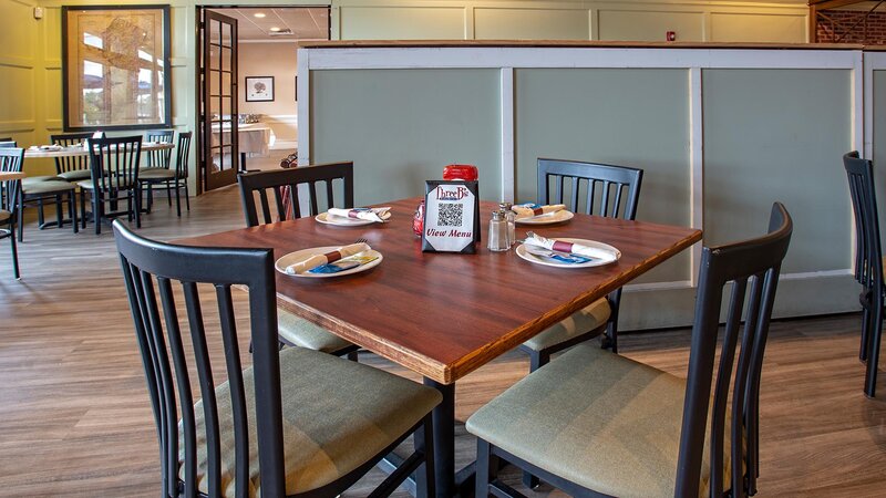 Dining room with set table for four