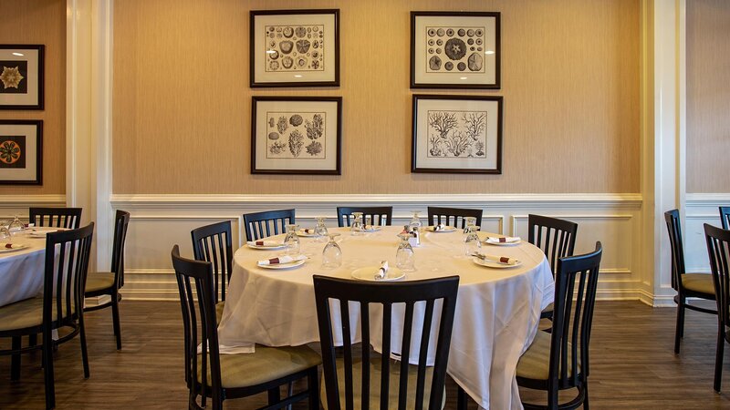 Dining room with round table set for seven